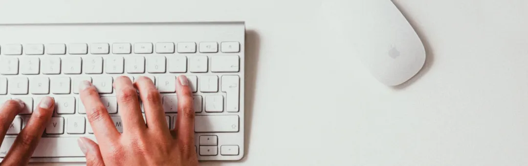 Student typing university admission form on laptop.